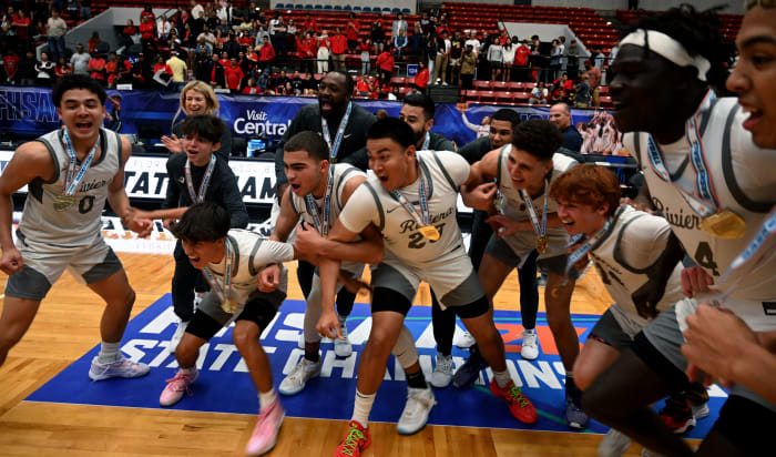 Riviera Prep players celebrate after winning the Class 3A state championship trophy by beating Windermere Prep for the second straight season in the state final.